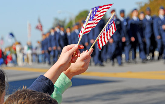 Flags waving at a parade